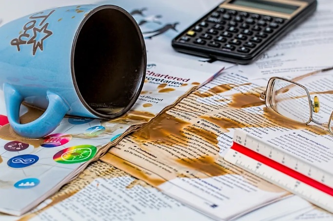 spilled coffee depicting careless