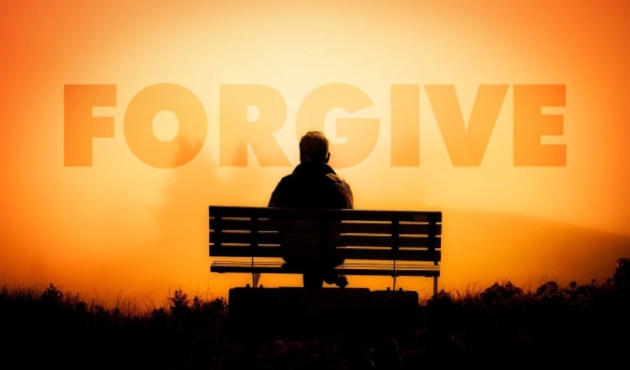 person pondering forgiveness